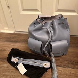 Blue Backpack with Drawstring Closure and Silver Accents